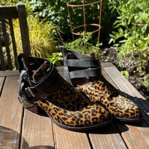 Leopard calf hair and black leather booties.